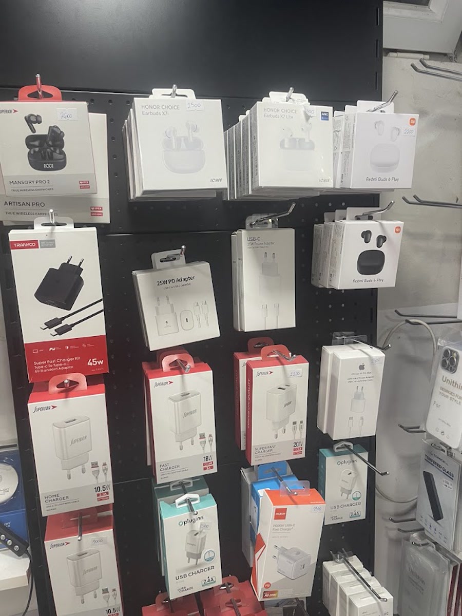 Observed wall of earbuds, chargers and phone accessories